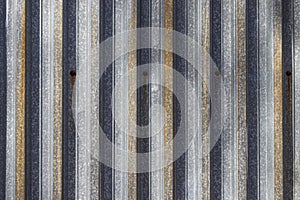 Texture of zinc covered wave-shaped steel sheet as an industrial background photo