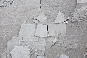 Textured background of cracked slate in shades of grey