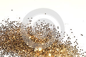 Textured background with golden glitter sparkle on white, decorative spangles in nostalgic colors