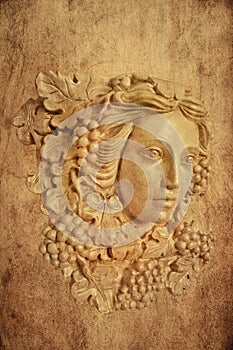 Textured Background of Grape haired Greek woman sconce statue