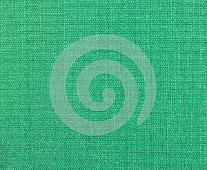 Textured background of green natural textile