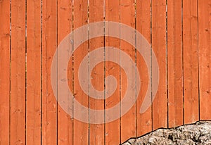 Textured background of red wooden wall