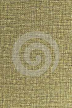 Textured background surface of textile upholstery furniture close-up. yellow color fabric structure