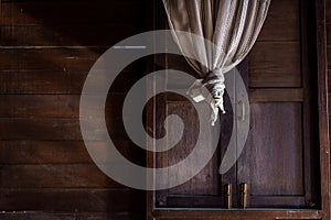 Textured background: Wooden pattern of Window and White lace curtains in traditional thai house