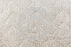 Textured beige fabric with diagonal zigzag pattern for interior design