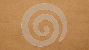 A textured beige surface with subtle variations in shade, creating a smooth gradient