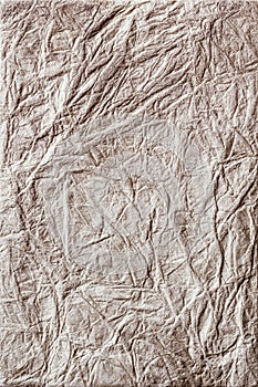 Textured beige wrinkled handmade paper background.