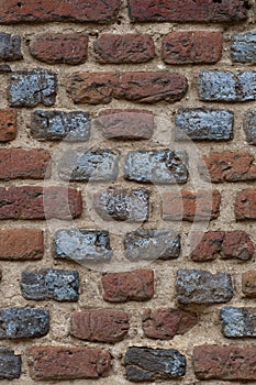 Textured Cross on the old brick wall