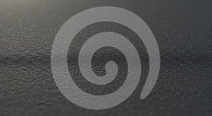 Textured dark gray surface macro abstract background pattern close up