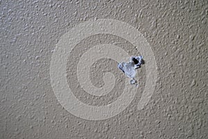 Textured dry wall with screw hole
