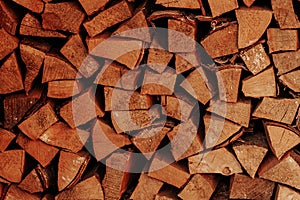 Textured firewood background, stack of chopped wood
