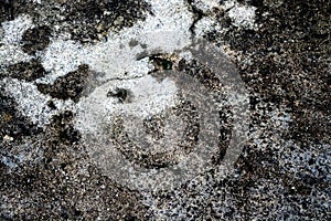 Textured floor with black stains