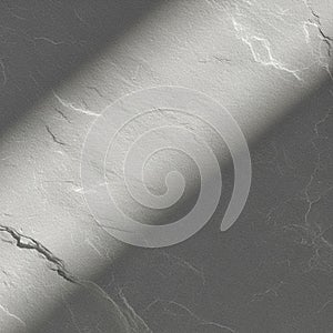 Gray surface with a diagonal light beam casting across it, creating a