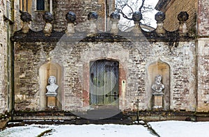 Textured historic wall with snow at Rousham House, Oxfordshire