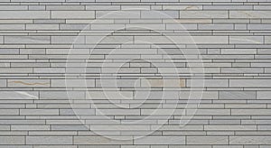Textured Light Gray Stone Wall with Horizontal Rectangular Slat Pattern background