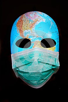 Textured mask with map  wearing surgical mask. Concept for corona virus pandemia