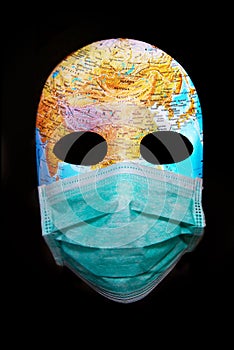 Textured mask with map  wearing surgical mask. Concept for corona virus pandemia photo