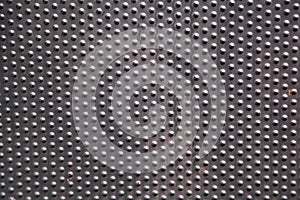 Textured metal background with dots