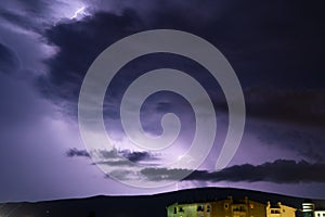 Textured night sky with bright lightning. Global warming