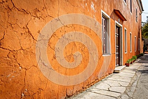 Textured orange wall with plaster patterns