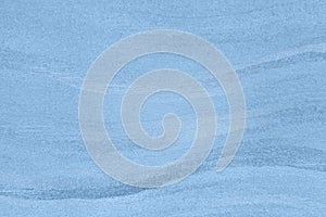 Textured paper background with blue surface effects