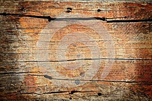 Textured pattern of red broke wooden board