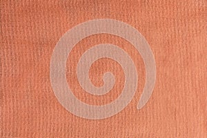 Textured peach color fabric, color of the year 2024 Peach Fuzz background