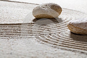 Textured pebbles across sinuous waves for spirituality photo