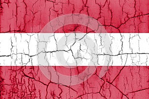 Textured photo of the flag of Austria with cracks.