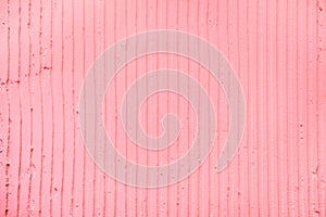 textured pink background with plaster vertical lines and stripes