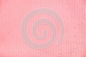 textured pink background with plaster vertical lines and stripes