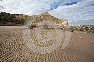 Textured sand and headlands at Cayton Bay photo