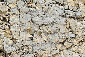 Textured stone background Rubble ballast in natural form in the rock wall