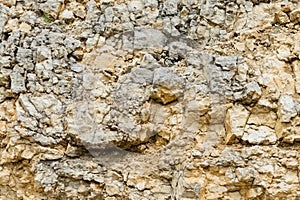 Textured stone background Rubble ballast in natural form in the rock wall