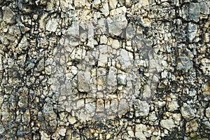 Textured stone background Rubble ballast in natural form in the rock wall