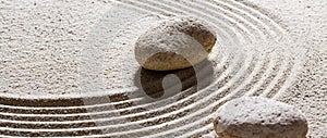 Textured stones on sand waves for suppleness and peace