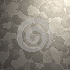 A textured surface features an abstract pattern of irregular, overlapping shapes