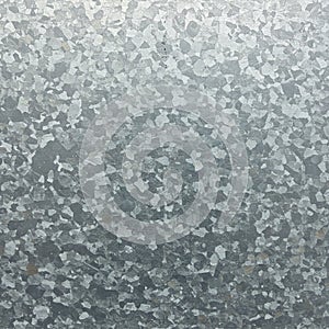 A textured surface featuring a pattern of light and dark gray patches, typical of