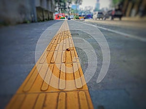 Textured Surface Indicator System on Road Sidewalks to Assist Blind Pedestrians