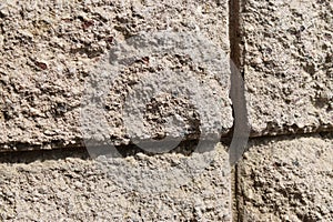 Textured upclose sand stone block wall