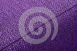 Textured violet furniture fabric with stitching