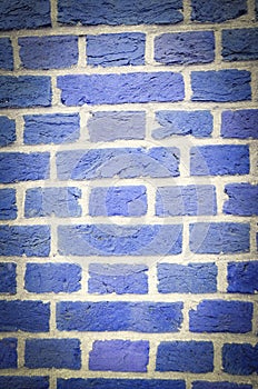 Textured wall of blue bricks, detailed background