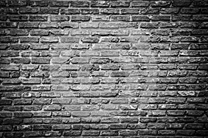 Textured wall of dark bricks, detailed background