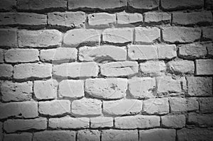 Textured wall of dark bricks, detailed background