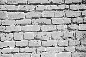 Textured wall of grey bricks, detailed background