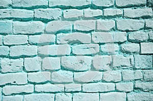 Textured wall of light blue bricks, detailed background