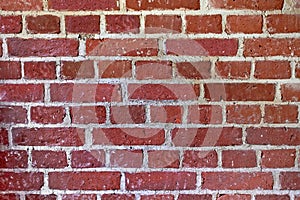 Textured wall made of red burnt brick. Ancient fortifications