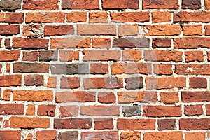 Textured wall made of red burnt brick. Ancient religious buildings