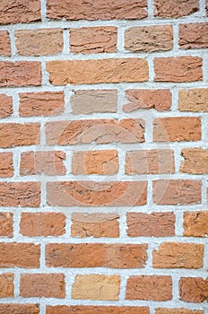 TExtured wall of red bricks, detailed background