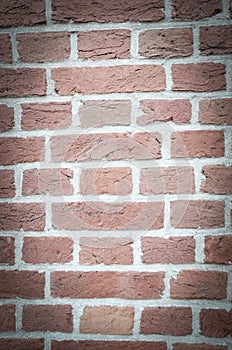 Textured wall of red bricks, detailed background